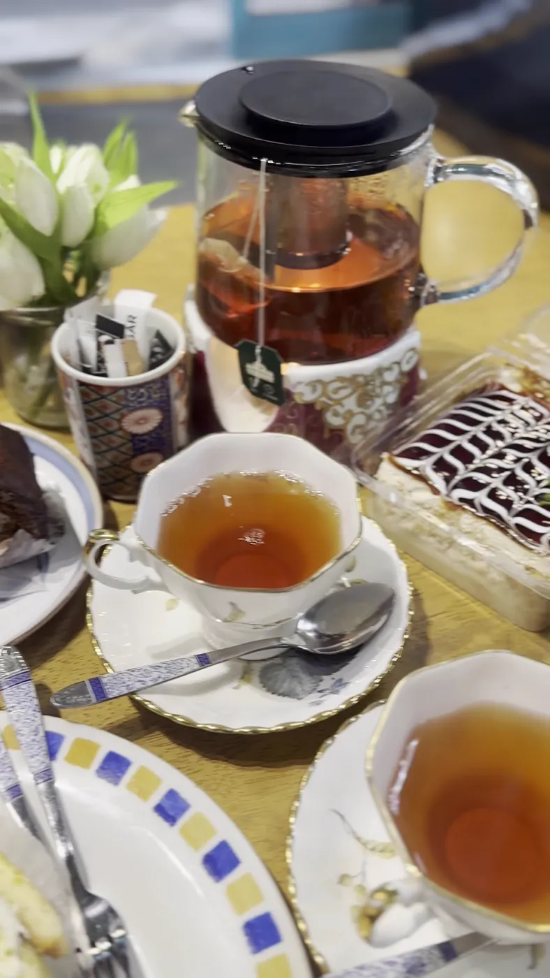 Persian tea in a glass teapot with china cups